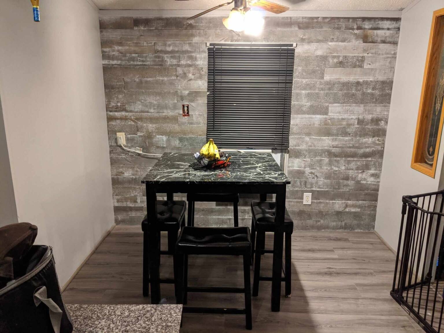 Finished gray plank dining room accent wall