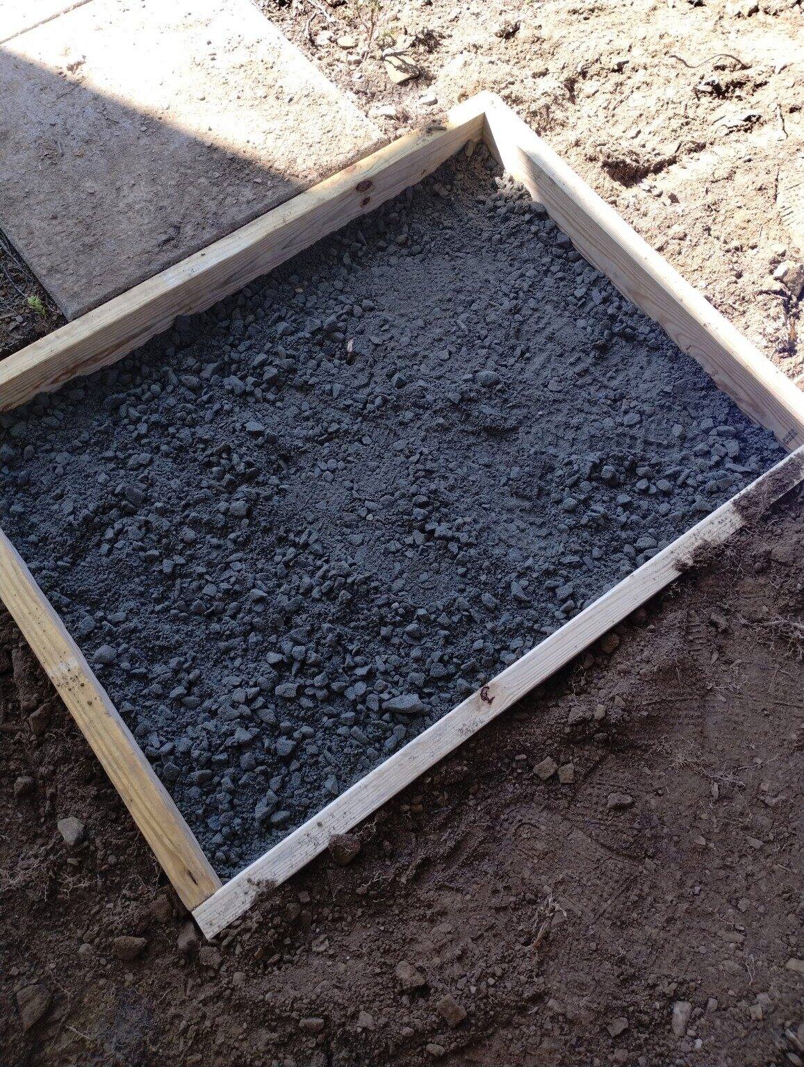 Concrete landing prepared for new deck stairs