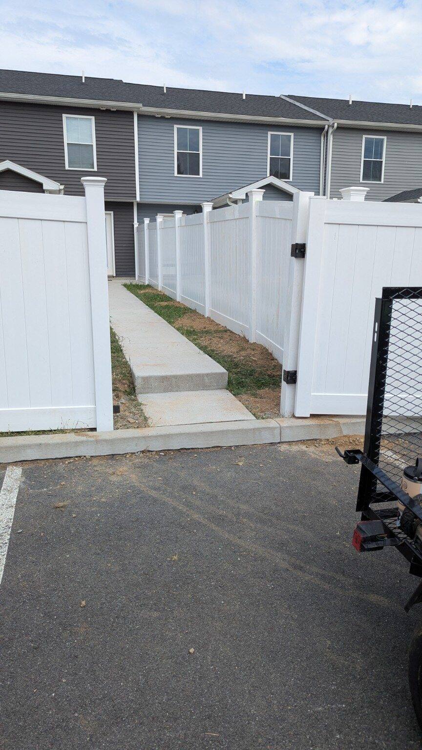 Finished white vinyl privacy fence gate