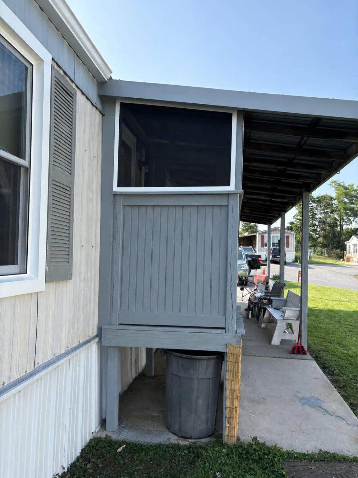 Side view of custom screened entry enclosure